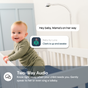 Baby in a crib with text indicating two-way audio feature, brand 'Luna' visible.