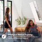 Woman in a modern living room with text about intelligent motion tracking.